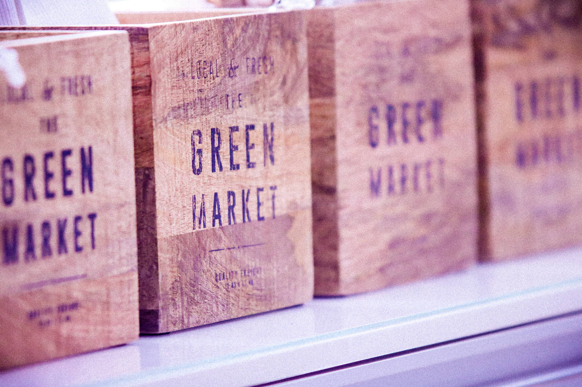 wood boxes with a green market marking